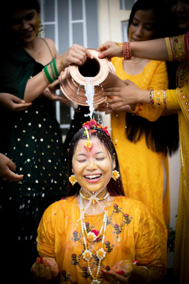 Family applying haldi to the bride